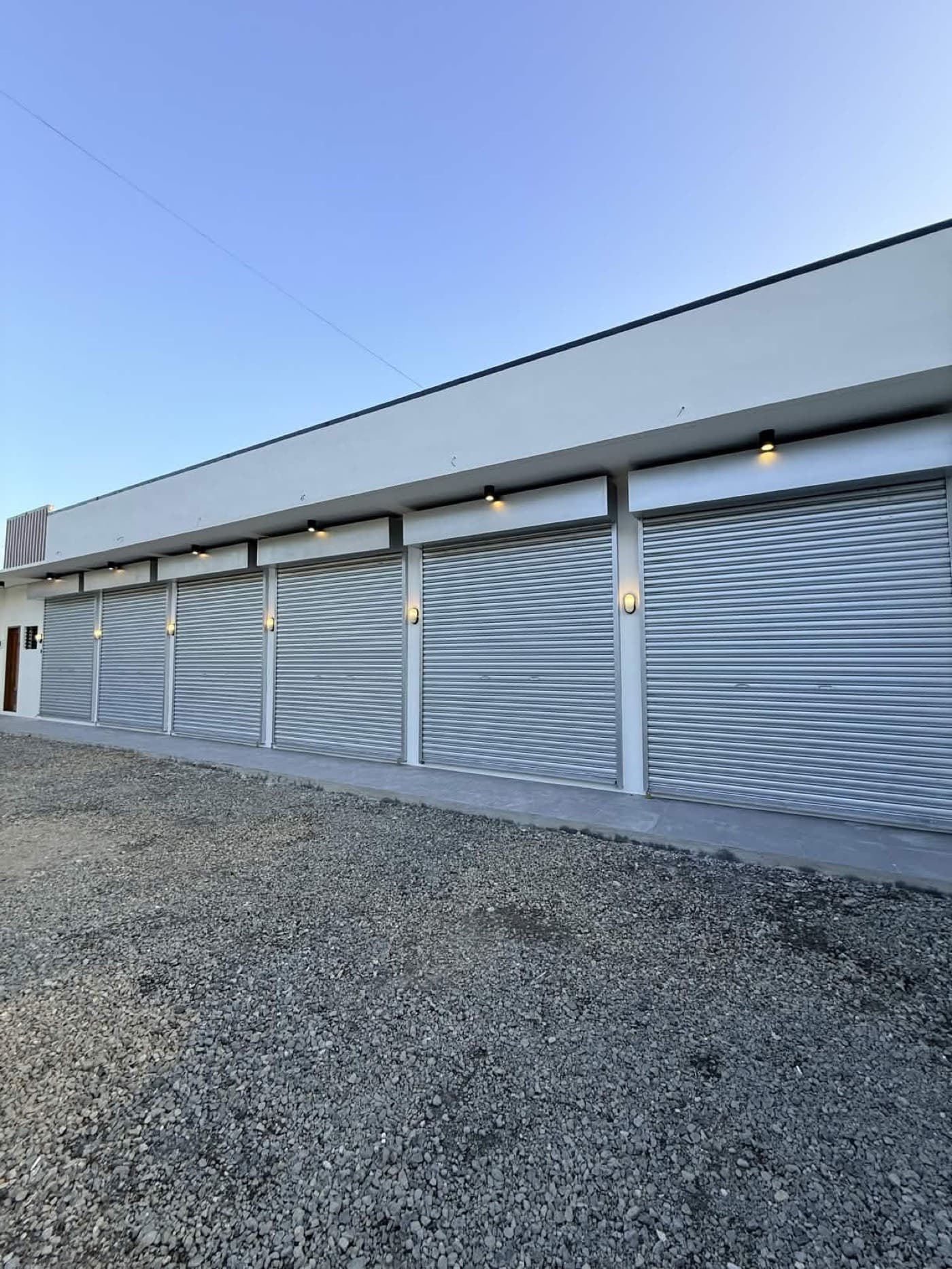 Installed rollup doors on a clean building facade